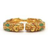 Tibetan gilt metal dragon bangle, 8cm wide