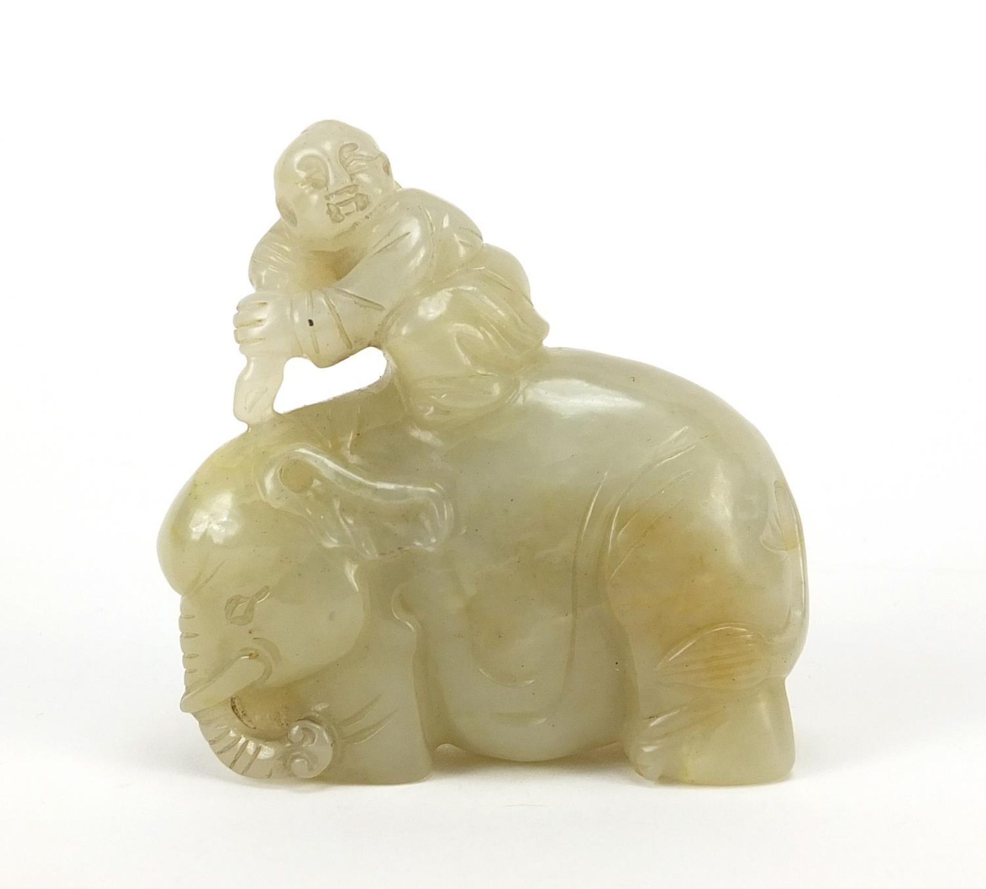 Chinese celadon and russet jade carving of a boy holding a ruyi sceptre on elephant, 6.5cm wide - Image 2 of 7