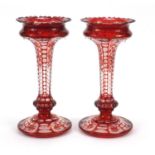 Pair of Bohemian ruby flashed cut glass lustre vases, each 28cm high