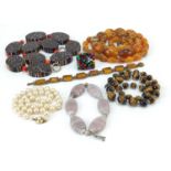 Vintage and later costume jewellery including amber coloured graduated bead necklace, tiger's eye