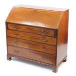 Edwardian inlaid mahogany bureau, the fall with fitted interior above four graduated drawers and