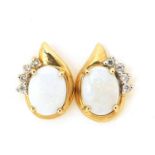 Pair of 9ct gold opal and diamond stud earrings, 14mm high, 2.9g