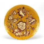 Continental pottery charger hand painted and gilded with stylised flowers, impressed 526 to the