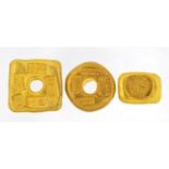 Three Chinese gold coloured metal ingots, the largest 4cm wide