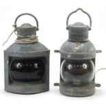 Two weathered ship's lamps including port, each with applied DL maker's mark, each 31cm high