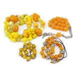Four amber coloured bead necklaces, total 173.2g