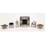 Silver items comprising three piece cruet with blue glass liners, a pair of open salts and an