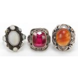 Three silver rings set with assorted stones including opal and carnelian, sizes M and N, 21.0g
