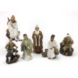 Six large Chinese mud men pottery figures, the largest 30.5cm high