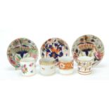Early 19th century English teaware comprising four coffee cans hand painted/gilded with flowers