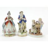 Three continental porcelain figures including a group of two lovers with flowers by Plaue, the