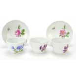 Meissen, German porcelain teaware hand painted with flowers comprising three cups and two saucers,