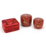 Chinese cinnabar lacquer style pot and cover and two Japanese lacquer boxes with covers, the largest