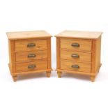 Pair of pine three drawer bedside chests with brass handles, 56.5cm H x 53cm W x 44.5cm D