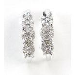 Pair of silver diamond stud earrings, 12mm high, 1.2g