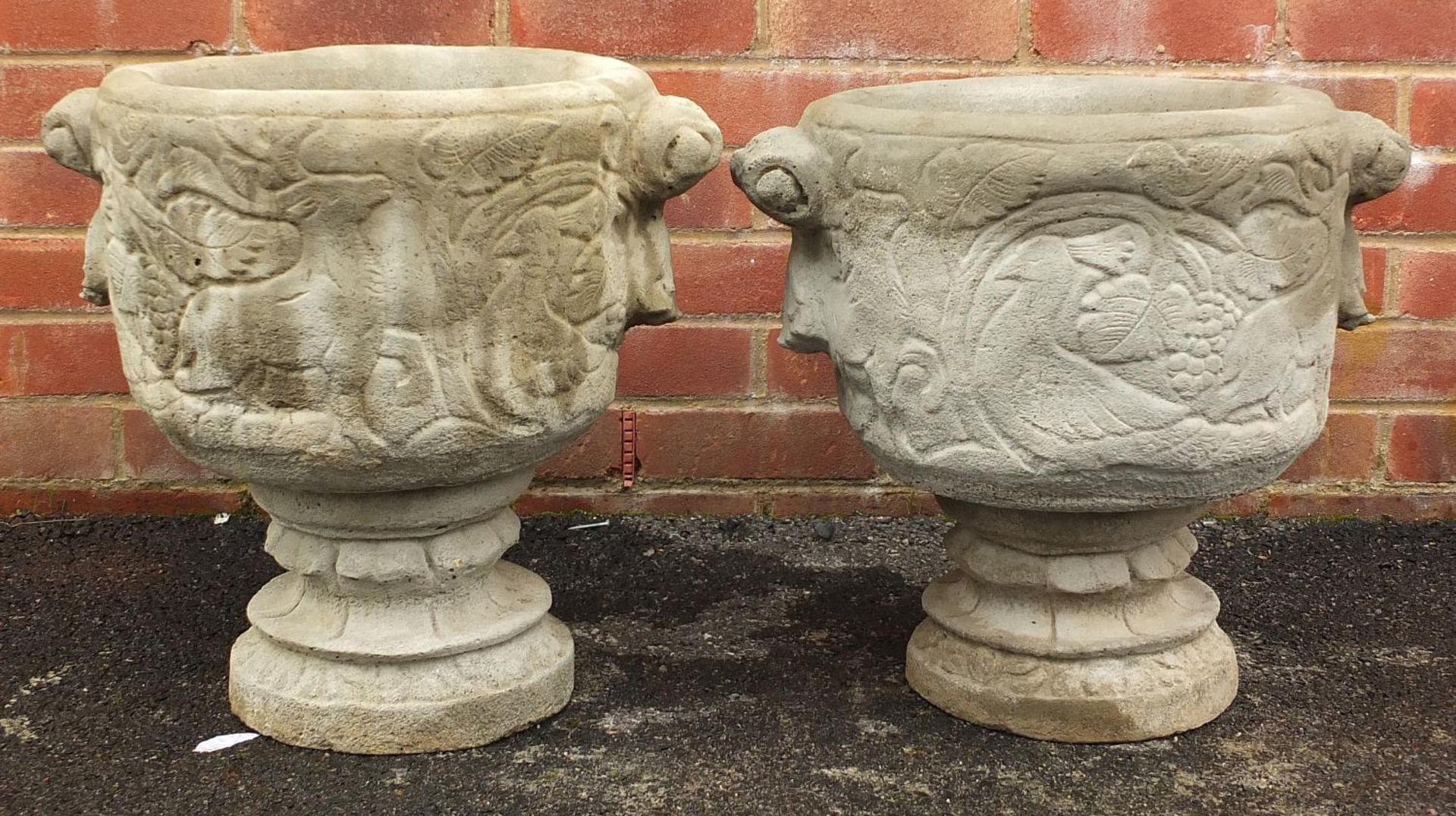 Pair of stoneware garden planters decorated with deer and birds, 46cm high x 48cm wide