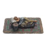 Cold painted bronze figure of a sleeping female with removable blanket in the style of Franz