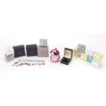 Thirteen pairs of silver cubic zirconia earrings and a silver cubic zirconia solitaire ring,