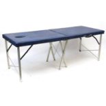 Folding massage table retailed by Marsh Couch, 65cm H x 185cm W x 71cm D