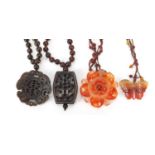 Four Chinese hardstone pendant bead necklaces, the largest 60cm in length, total 206.0g