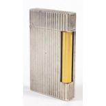 S T Dupont, silver and gold plated pocket lighter with box, serial number 85GHE04, 5.5cm high