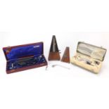 German metronome and two cased medical instrument sets, the largest 32.5cm wide