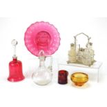 Antique and later glassware including cranberry glass table bell, five piece cruet on stand, 19th