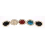 Five silver cabochon stone brooches including turquoise and mother of pearl, 2.8cm wide, 24.5g