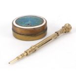 Victorian gold coloured metal propelling pencil and oval brass pill box with enamelled lid, the