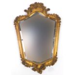 Ornate gilt framed cartouche wall mirror with bevelled plate, 52cm high x 35cm wide