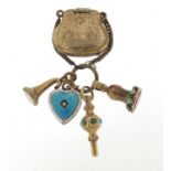 Antique gold coloured metal fobs, watch key, locket in the form of a clutch bag and an enamelled