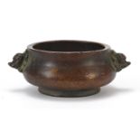 Chinese patinated bronze censer with animalia handles and impressed character marks to the base,