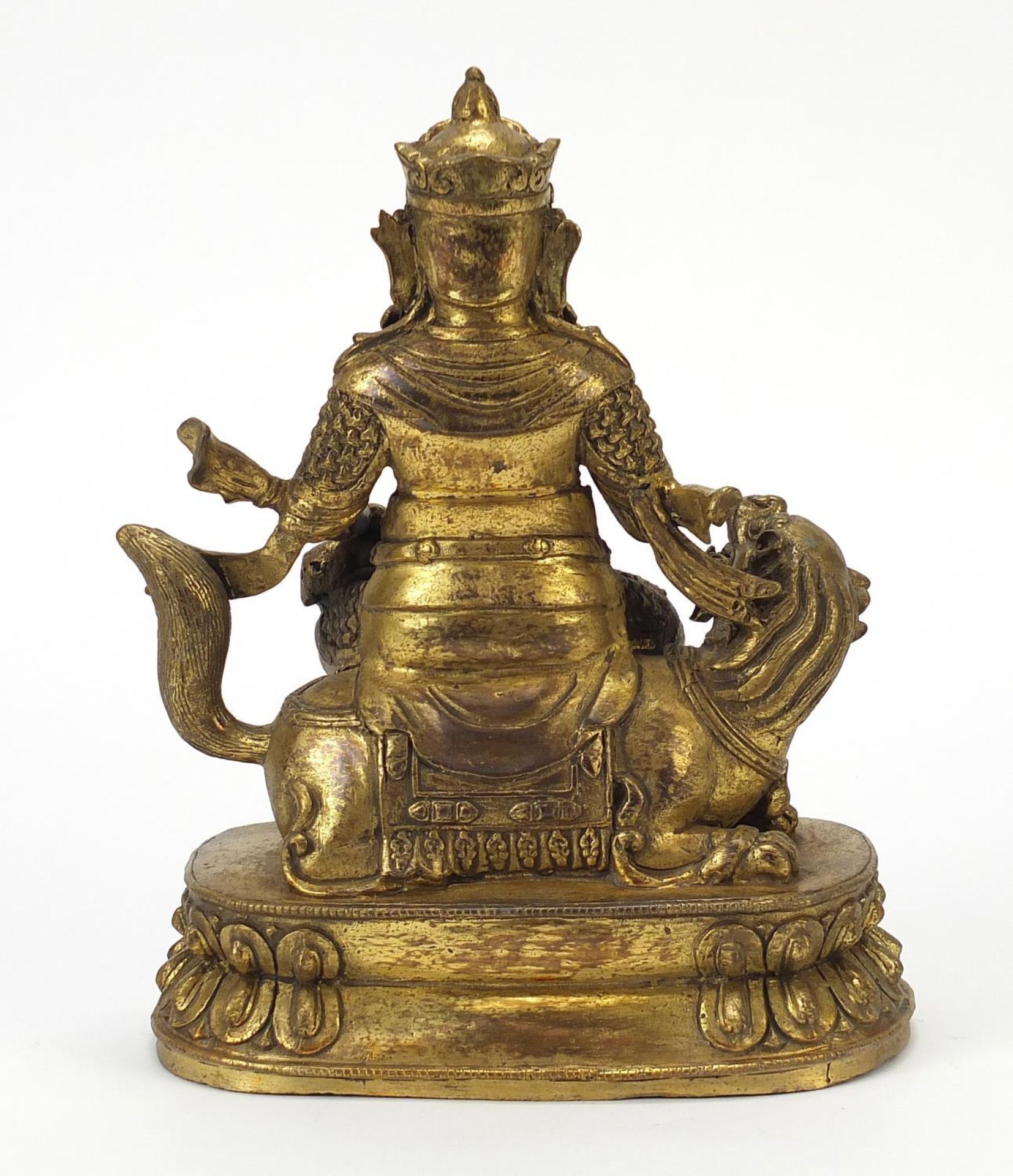 Chino Tibetan patinated gilt bronze figure of an Emperor on mythical animal, 23.5cm high - Image 4 of 8