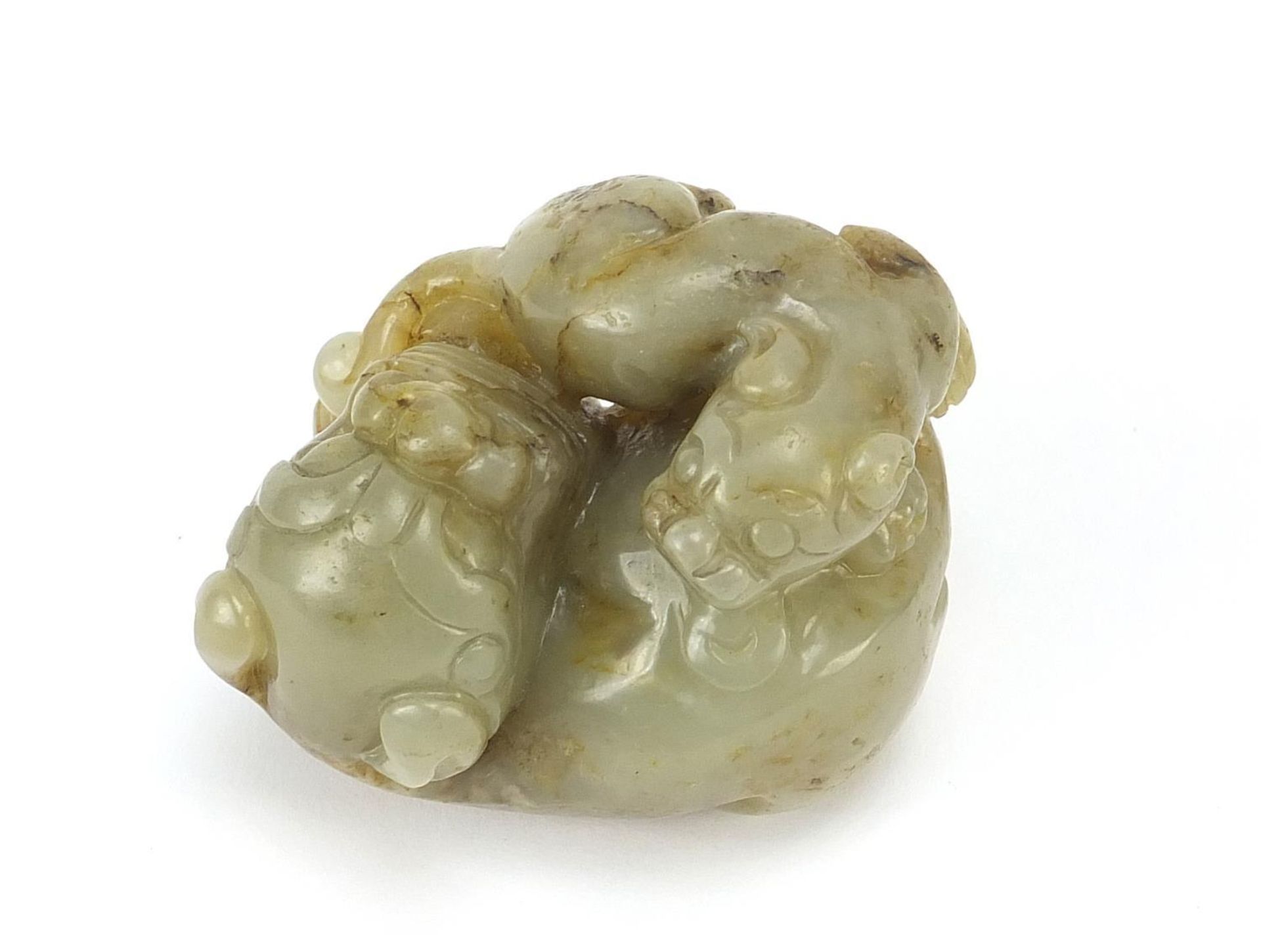 Chinese celadon and russet jade carving of two mythical lions, 6cm wide - Image 5 of 6