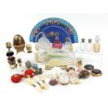 Objects including scent bottles, shells, compacts and a large porcelain egg trinket, the largest