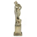 Stoneware garden figure of a semi nude maiden raised on a square column base, 118cm high