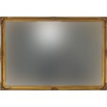 Rectangular gilt framed wall mirror with bevelled glass, 83cm x 57cm