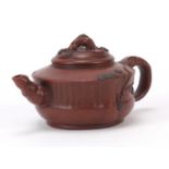 Chinese naturalistic Yixing terracotta teapot, impressed character marks to the base, 16cm in length