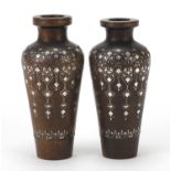 Pair of Indian hardwood vases with silver foliate inlay, each 16cm high