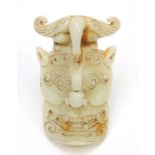 Chinese russet jade carving of a face mask, 18cm high