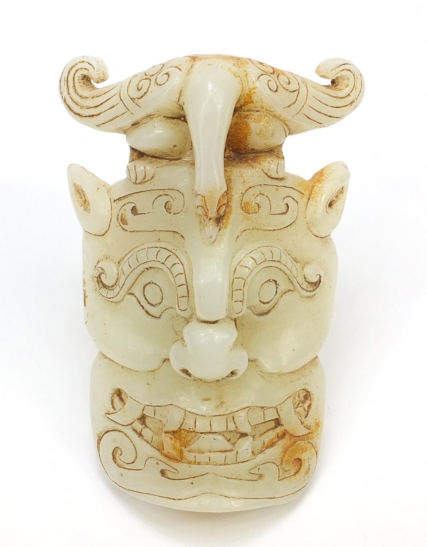 Chinese russet jade carving of a face mask, 18cm high