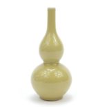 Chinese porcelain double gourd vase having a yellow glaze, Kangxi blue ring marks to the base,