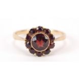 9ct gold garnet cluster ring, housed in an E Basset Willis box, size M, 1.5g