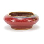 Chinese porcelain brush pot having a sang de boeuf glaze, 10.5cm in diameter