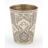 Continental silver beaker profusely engraved with flowers and foliage, impressed marks to the