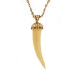 Ivory tooth pendant with 9ct gold mount on a 9ct gold rope twist necklace, 4.5cm high and 46cm in