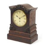 19th century mahogany fusée mantle clock carved with leaves and berries, the painted dial with Roman