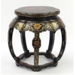 Large Chinese black lacquered stand gilded with flower heads amongst foliate scrolls and flowers,