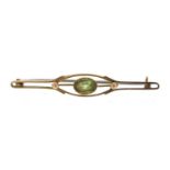 Art Nouveau 9ct gold bar brooch set with a green stone, possibly peridot, 5cm wide, 2.0g