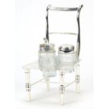 Novelty silver plated and cut glass three piece cruet of chair design, 20cm high